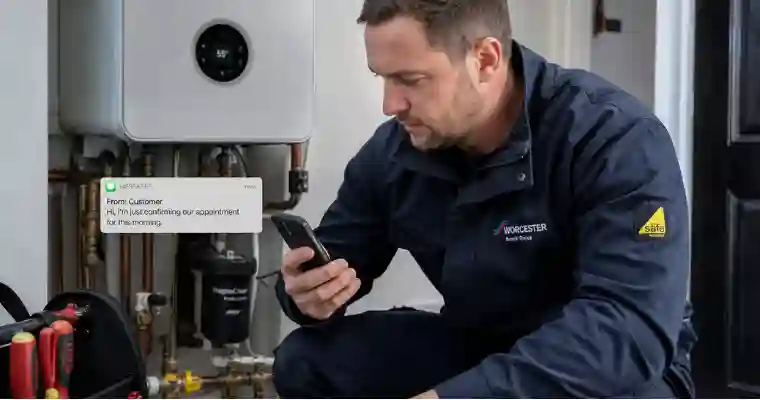 UK gas engineer on a boiler job unable to answer an incoming phone call, missed call text back automatically sent to the caller
