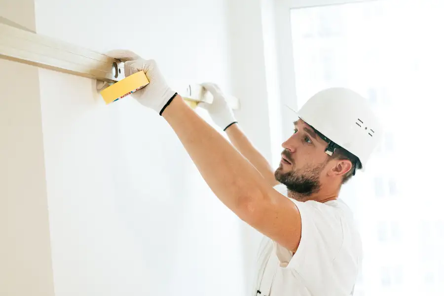 UK builder on residential construction site managing extension project