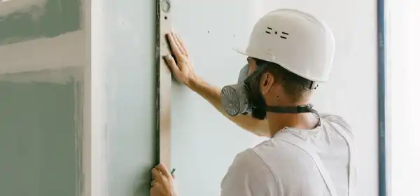 UK builder on residential construction site managing extension project