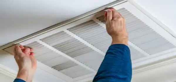 HVAC engineer installing air conditioning system in UK commercial property